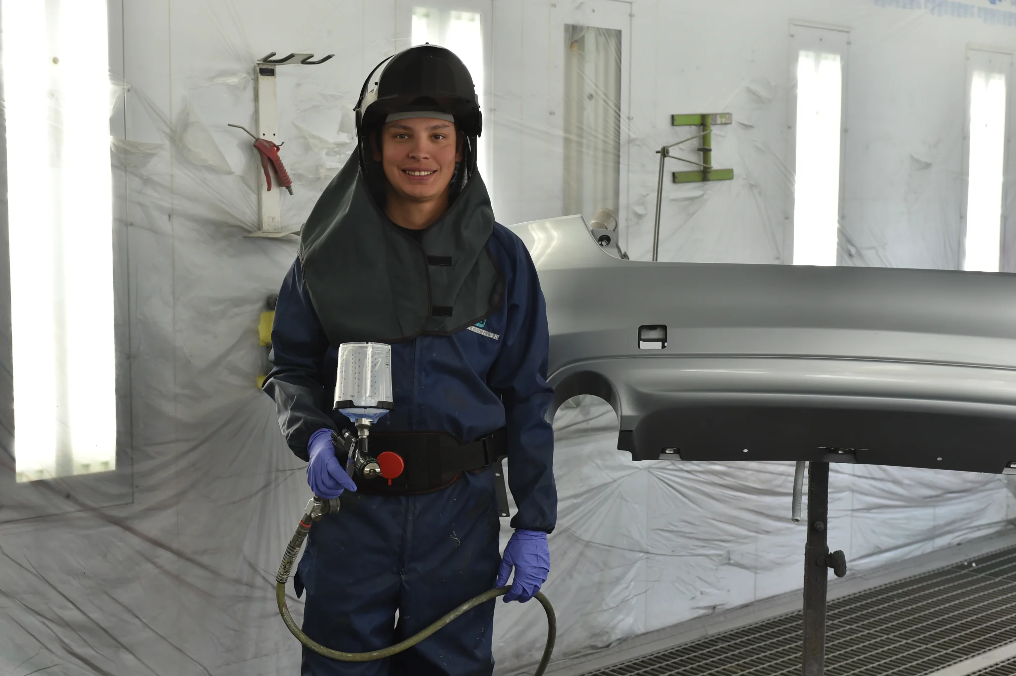 Man in a paint booth portrait.