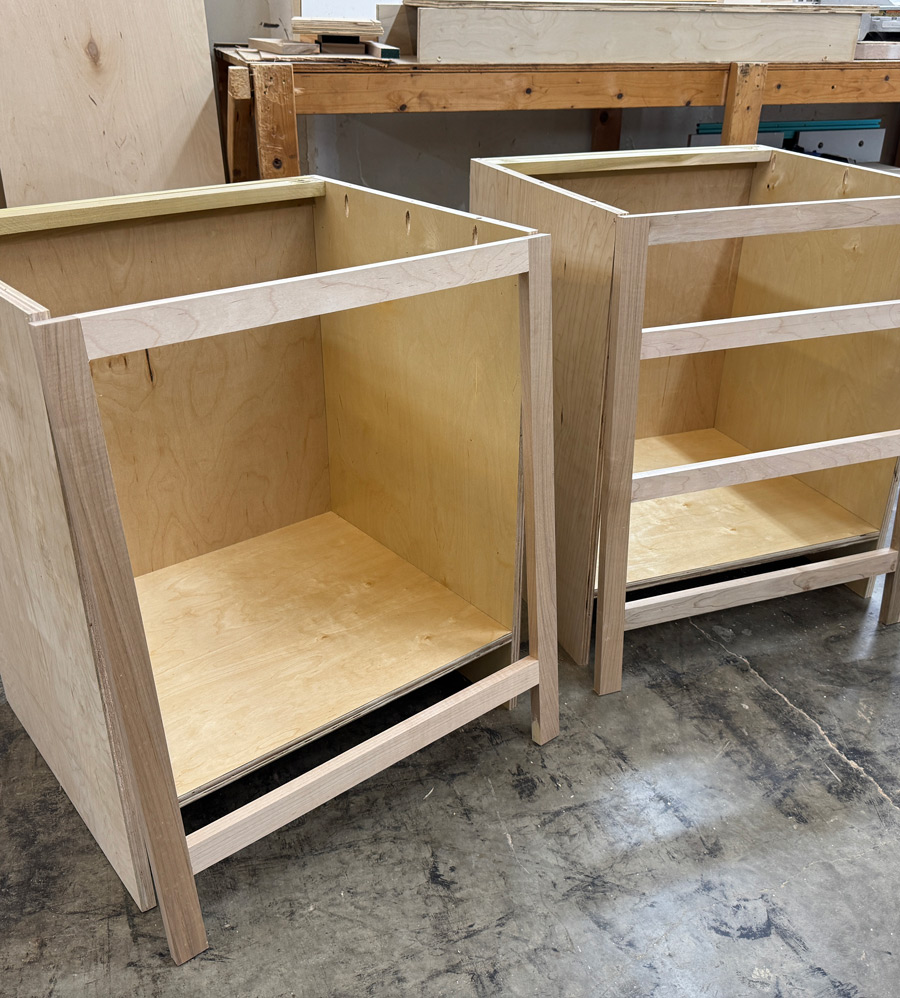 Two unfinished cabinet bases with face frames.