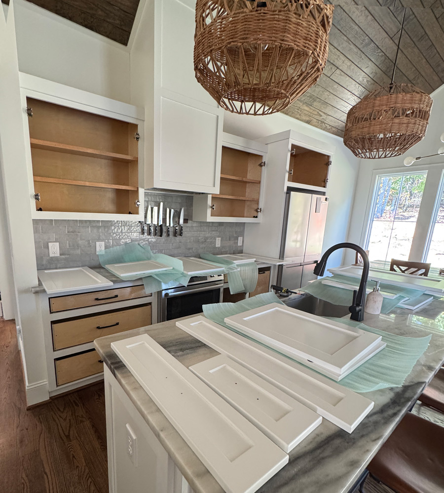 Kitchen with cabinet doors ready to be replaced.
